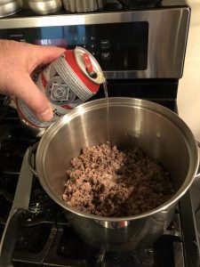 pour the beer into the chili